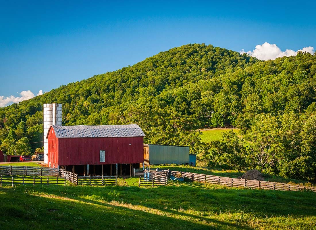 Insurance by Industry - View of a Small Farm Next to the Mountains in Rural Virginia on a Sunny Day