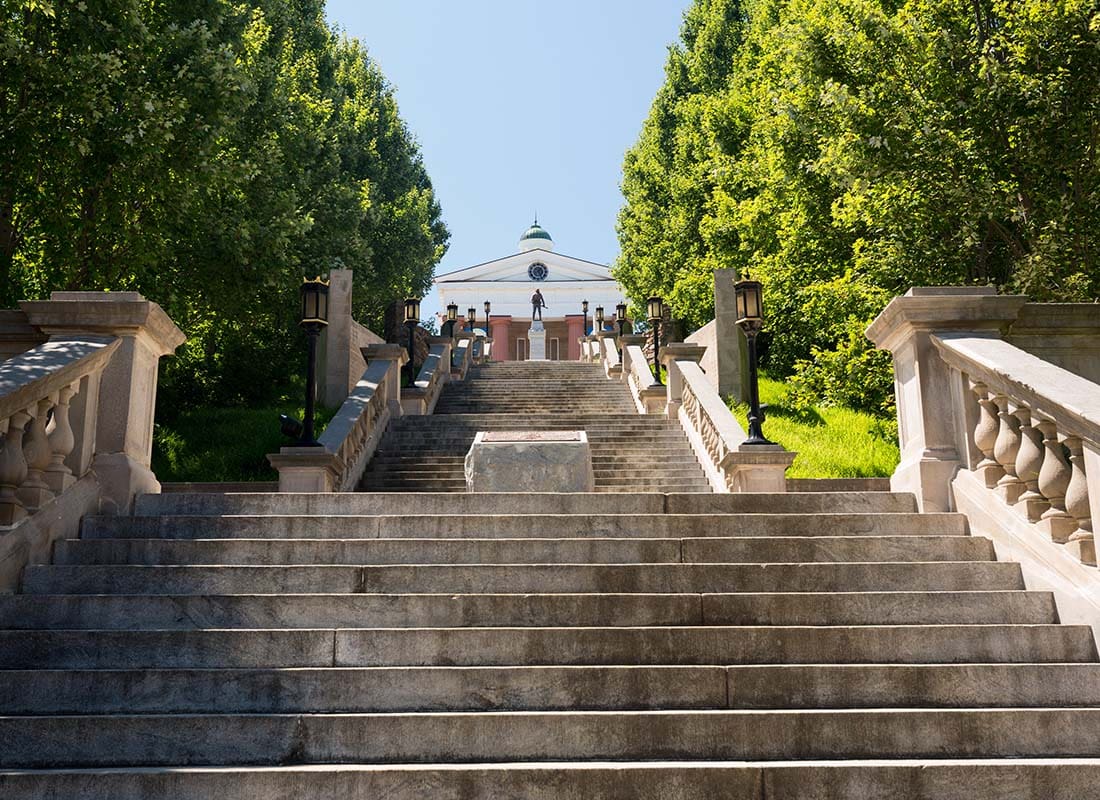 We Are Independent - View of Stairs Leading Up to a Municipal Building Next to Green Trees in Historic Lynchburg Virginia